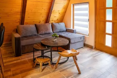 a living room with a couch and a table at Jerry's Forest in Banja Luka