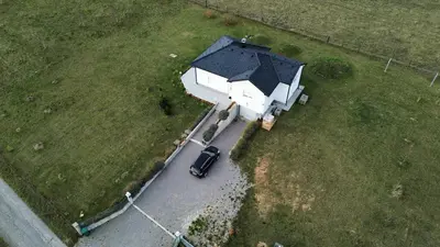 an aerial view of a house with a car in a field at Vila Anamari in Livno