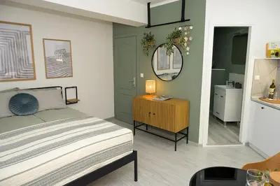 a bedroom with a bed and a mirror at ZenDen in Jajce