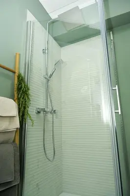 a bathroom with a shower with a glass door at ZenDen in Jajce