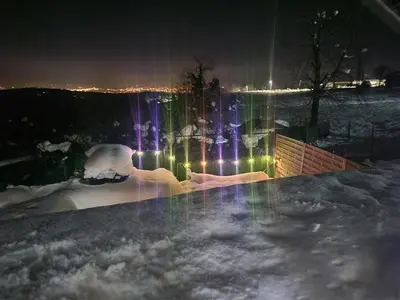 a view of a city at night with lights at VIKENDICA GARFILD SA BAZENOM i SAUNOM BANJA LUKA in Banja Luka