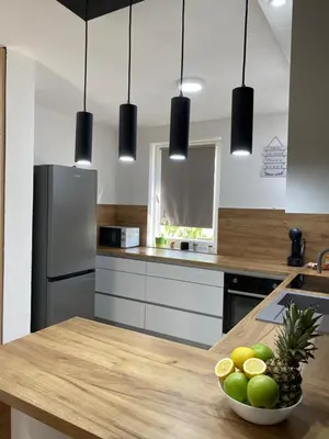 a kitchen with a table with a bowl of fruit on it at Villa La Casa -Family house in Jajce