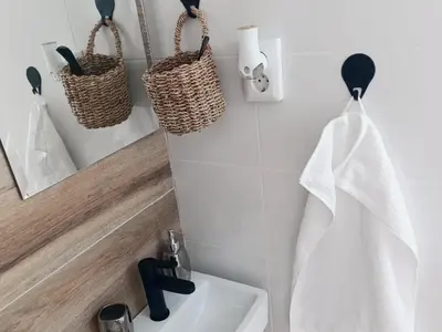 a bathroom with a sink and a mirror and a towel at Apartman EDEN in Jajce