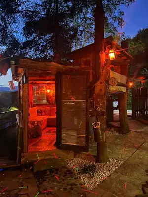 a tree house with a couch in the backyard at Nature Neno in Visoko