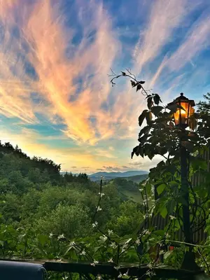 a street light with a sunset in the sky at Nature Neno in Visoko