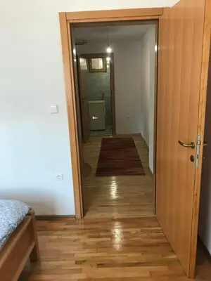 a hallway with a door leading to a bedroom at Vila Damir in Gornja Šišava