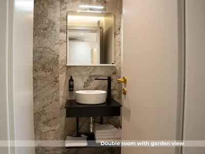 a bathroom with a sink and a mirror at Lala in Bosanska Krupa