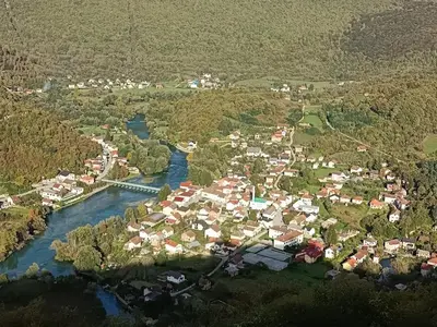 an aerial view of a small town next to a river at Apartman Nadja&Dani in Kulen Vakuf
