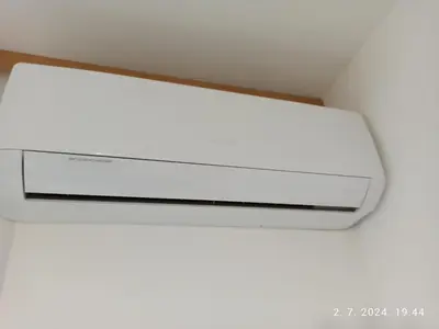 a white light hanging from a ceiling at Apartman Oaza in Doboj