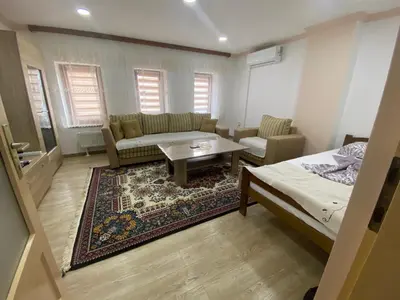 a living room with a couch and a coffee table at Apartment Poturmahala 2 in Travnik