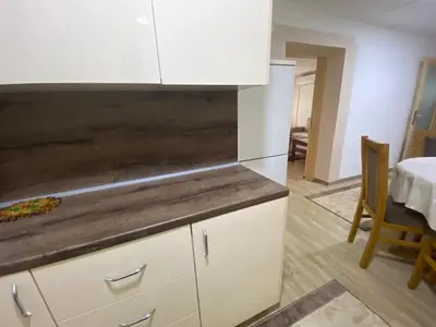 a kitchen with white cabinets and a counter top at Apartment Poturmahala 2 in Travnik