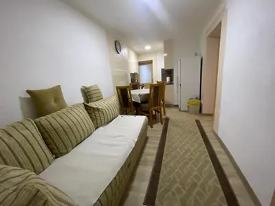 a living room with a couch and a table at Apartment Poturmahala 2 in Travnik
