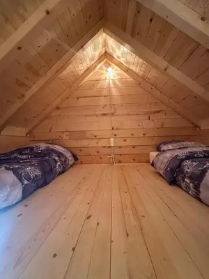 a room with two beds in a log cabin at Luxury Glamping Grabovica - Vital Resort in Skender Vakuf