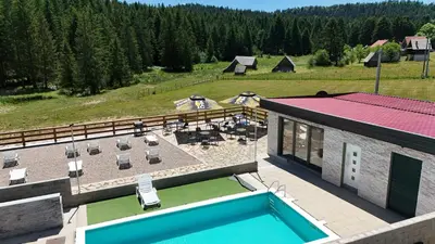 an aerial view of a house with a swimming pool at Luxury Glamping Grabovica - Vital Resort in Skender Vakuf
