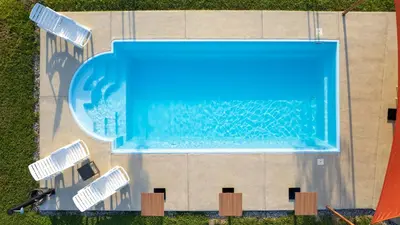 an overhead view of a swimming pool in the grass at Villa, Vikendica - Sunny Hill - jacuzzi, sauna in Banja Luka