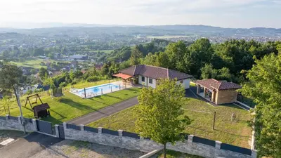 an aerial view of a house with a swimming pool at Villa, Vikendica - Sunny Hill - jacuzzi, sauna in Banja Luka