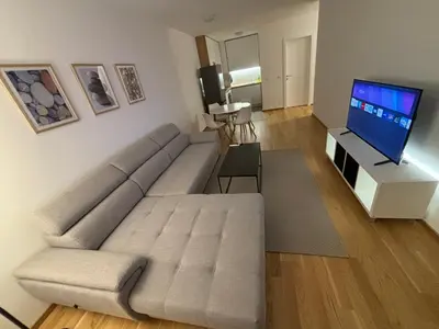 a living room with a couch and a flat screen tv at Stan na dan Simba in Banja Luka