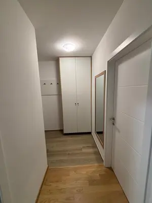 an empty hallway with a closet and a door at Stan na dan Simba in Banja Luka