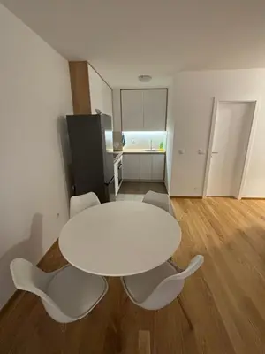 a white table and chairs in a room at Stan na dan Simba in Banja Luka