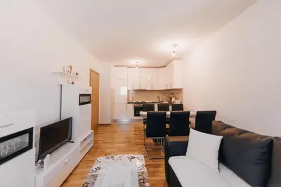 a living room with a couch and a kitchen at Pronađi svoj mir in Livno