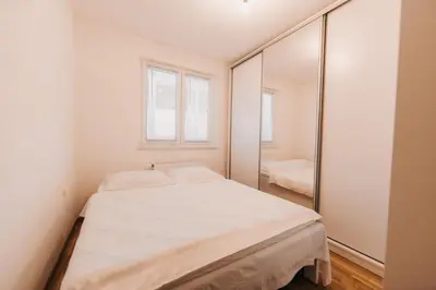 a bedroom with a bed and a mirror at Pronađi svoj mir in Livno