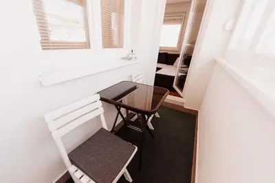 a small table and chair in a small room with a window at Pronađi svoj mir in Livno