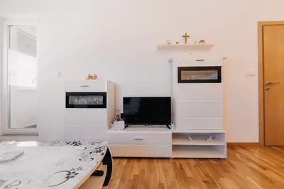 a living room with a tv on a dresser at Pronađi svoj mir in Livno