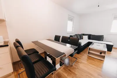 a living room with a table and a couch at Pronađi svoj mir in Livno