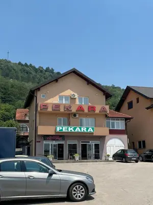 a car parked in front of a hotel at Apartment M&S Gračanica in Gračanica