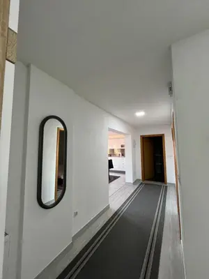 a hallway with a mirror on the wall at Apartment M&S Gračanica in Gračanica