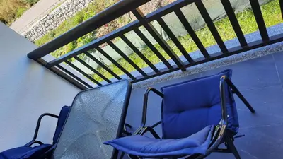 two chairs sitting on top of a balcony at Apartman Ružica in Tomislavgrad