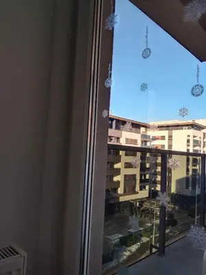 a window with a view of a building at Apartman IJA in Banja Luka