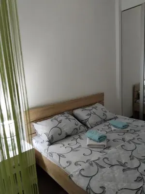 a bedroom with a bed with two pillows on it at Apartman IJA in Banja Luka