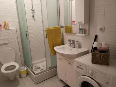 a bathroom with a toilet and a sink and a shower at Apartman IJA in Banja Luka