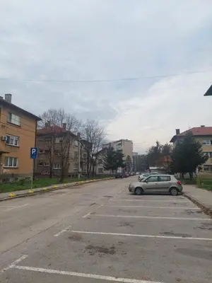 a car parked in a parking lot on a street at Apartment Vela in Tuzla