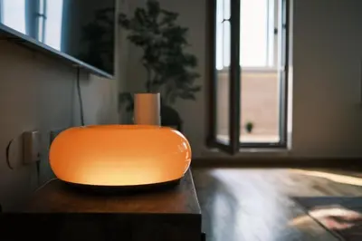 an orange chair sitting on a table in a room at Ikigai Penthouse Apartment in Banja Luka