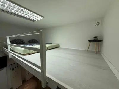 a bedroom with a bunk bed in a room at Studio apartman Bišće in Bihać