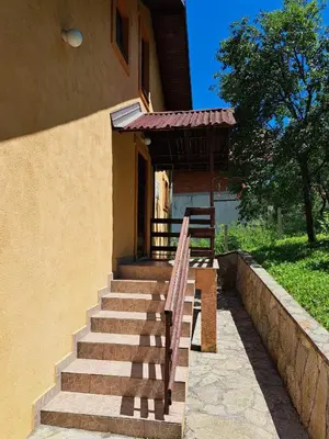 a set of stairs leading to a house at Lake House Ceric in Jajce