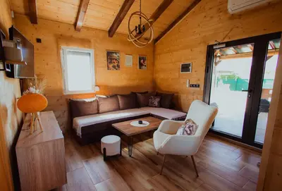 a living room with a couch and a table at Rustic Casa in Prijedor