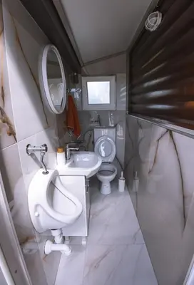 a small bathroom with a toilet and a sink at Rustic Casa in Prijedor
