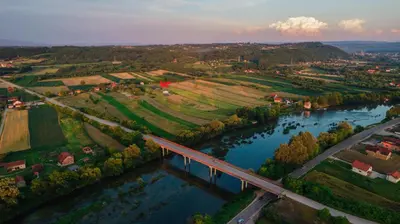 an aerial view of a river with a bridge at Rustic Casa in Prijedor