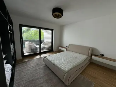 a bedroom with a bed and a large window at Villa Modern in Bihać