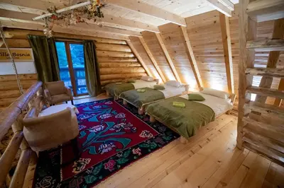 a room with four beds in a log cabin at Villa Bosnia in Donji Vakuf