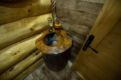 a bathroom with a wooden sink in a room at Villa Bosnia in Donji Vakuf