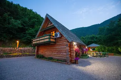 a small log cabin with a roof at Villa Bosnia in Donji Vakuf