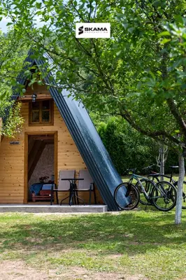 a slide on the side of a house at Moonlight & Starlight lodges in Orašac