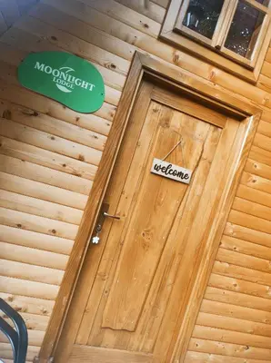 a wooden door with a welcome sign on it at Moonlight & Starlight lodges in Orašac