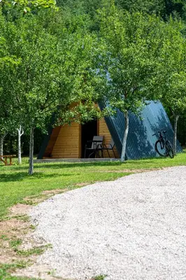 a small cabin with a table and a chair in it at Moonlight & Starlight lodges in Orašac