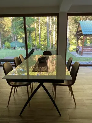 a glass table and chairs in a room at Villa Bella Una - Prizemlje in Cazin