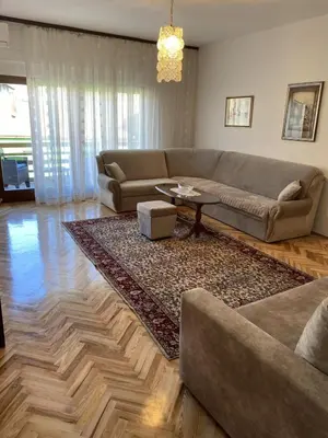 a living room with a couch and a table at Apartment Alma in Bihać